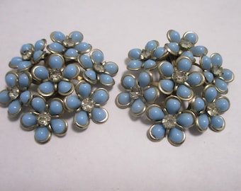 Sky Blue Forget Me Nots: Thermoset, rhinestone & silver-tone setting for clip-back earrings. Excellent condition. Estate jewelry item #2161