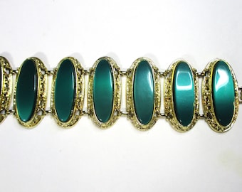 Electric Emerald Statement Bracelet: Runway Vintage Bezel-set Emerald in filigree gold-tone settings, 2" wide. Estate sale find #2208