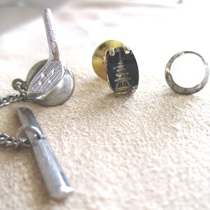 Drive It Home Tie Tacs: 1 Swank golf driver, 1 Swank Black Japanese reverse carved gold pagoda,  1 moonstone, vintage jewelry.  Sudy Set.