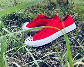 red spiked converse