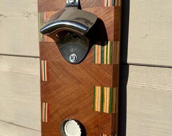 Recycled skateboard bottle opener with magnetic cap catcher