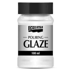 May include: A white plastic bottle with a black cap, labeled "pentart POURING GLAZE 100 ml." The label is silver with black text. The bottle is filled with a white, viscous liquid, likely used for art projects or crafts.