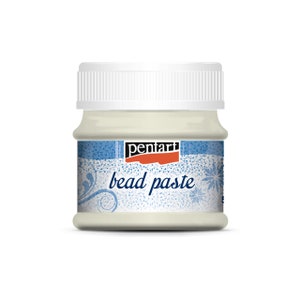 May include: A jar of off-white bead paste with a white lid. The label features the brand name "pentart" in red and black, along with the words "bead paste" in a stylized font. The label has a blue and white decorative border.
