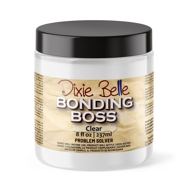May include: A clear glass jar with a black lid containing Dixie Belle Bonding Boss Clear Problem Solver. The jar is labelled with the product name, size (8 fl oz / 237 ml), and instructions to shake well before use.