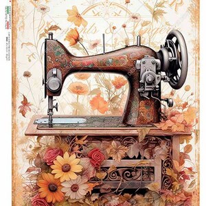 May include: Vintage sewing machine with a floral design, surrounded by autumn leaves and flowers. The machine is on a wooden table with intricate carvings. The text "PRET-A-PORTER" is visible in the background.