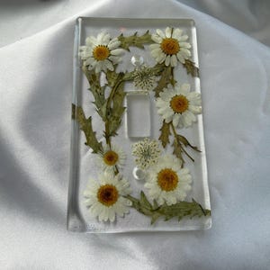 Single Light Switch cover: Daisy,cream colored flowers and gold and crystal glass red and silver, white flowers and greenery, New perwinkle