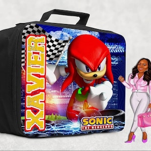 May include: Black lunch bag featuring a vibrant graphic of Knuckles from Sonic the Hedgehog, holding a checkered flag. The name "XAVIER" is printed vertically in yellow and red. The bag has a black handle and zipper.