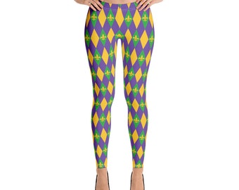 May include: Purple leggings with a repeating pattern of yellow and green diamonds and gold fleur-de-lis.