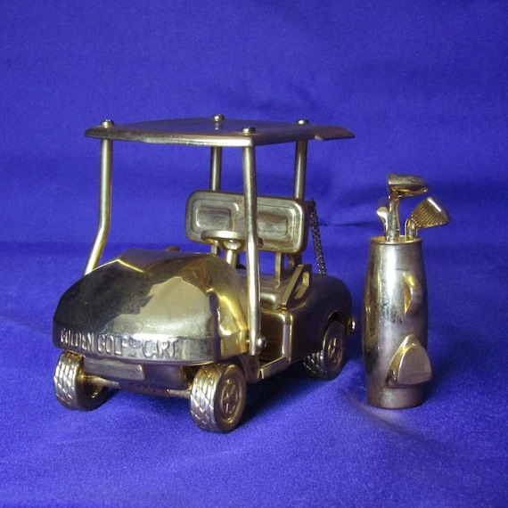 Vintage Gold-Plated Golf Cart with Clubs