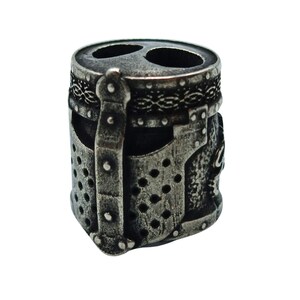 May include: A silver metal bead with a detailed design of a knight's helmet. The bead has a textured surface and a raised design.