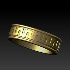 May include: A gold-toned ring featuring a continuous embossed Greek key pattern around the outer band. The design consists of a repeating geometric meander motif set between two raised, smooth edges that encircle the entire circumference.