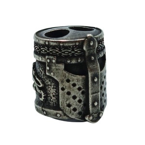 May include: A silver metal charm in the shape of a knight's helmet. The helmet has a detailed design with a visor and a chainmail pattern.