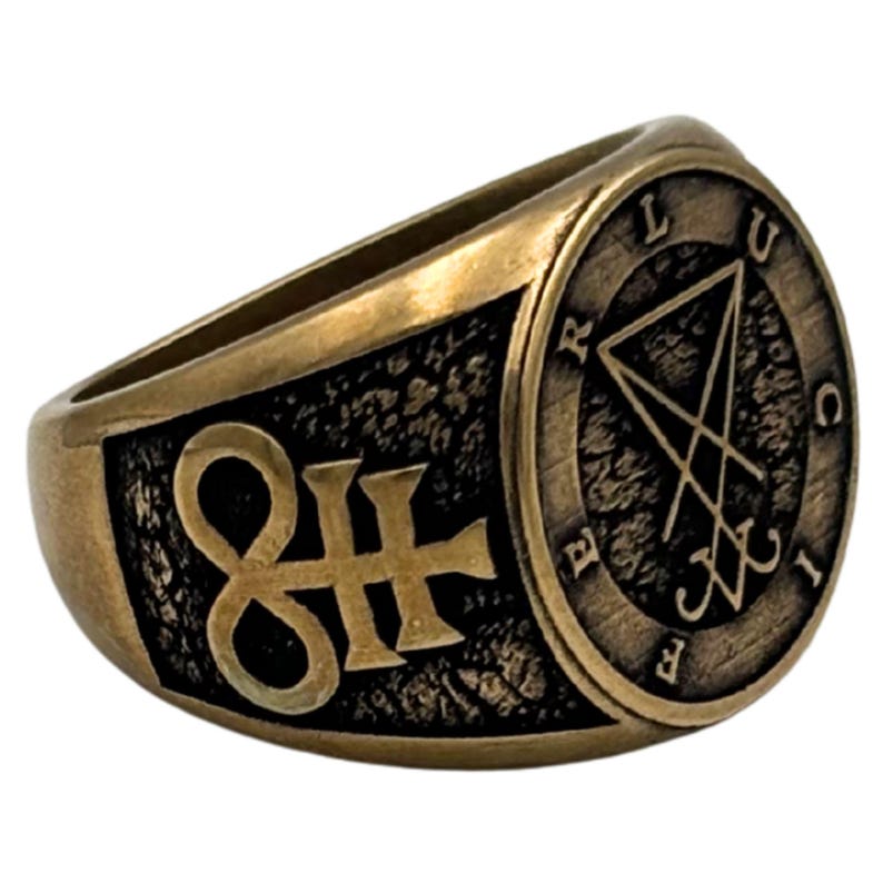 May include: A brass-toned metal ring featuring a dark, textured background. The side displays a raised symbol resembling a stylized cross with an infinity loop, while the circular face shows the Sigil of Lucifer with the letters L U C I F E R.