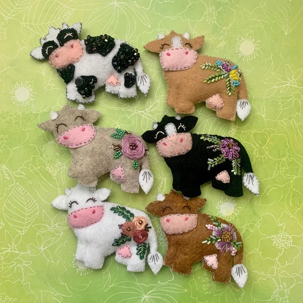 Felt Cow ornaments with beaded and embroidered embellishments