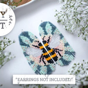May include: DIY kit for making beaded earrings featuring a bee design with blue, white, pink, yellow, and black beads. The kit includes all the beads and supplies needed to make the earrings. *Earrings not included*.