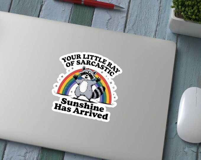 Little ray of sarcastic sunshine has arrived raccoon rainbow sticker sassy