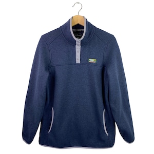 May include: A blue fleece pullover with a single button placket and a small L.L.Bean logo patch on the chest. The pullover has a white trim around the neck, cuffs, and hem.