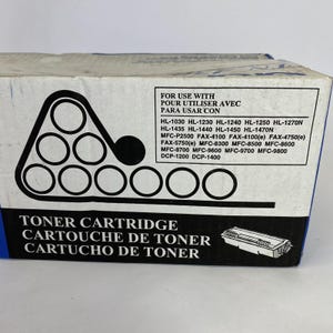 May include: A white and blue toner cartridge box with black text and graphics. The box includes a list of compatible printer models and the words "Toner Cartridge" in English, French, and Spanish.
