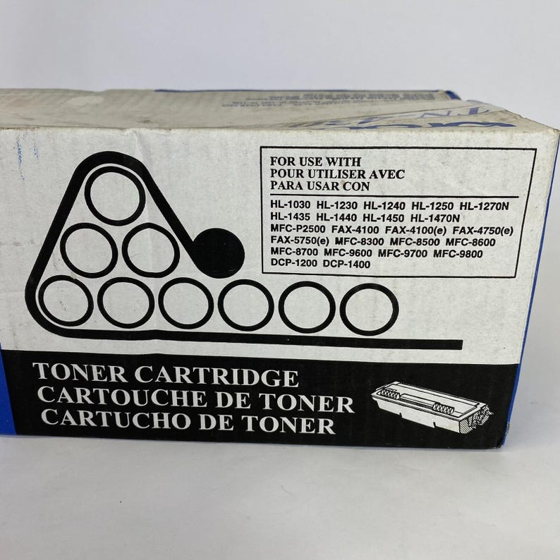 May include: A white and blue toner cartridge box with black text and graphics. The box includes a list of compatible printer models and the words "Toner Cartridge" in English, French, and Spanish.