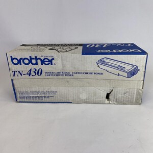 May include: A Brother TN-430 toner cartridge box. The box is white with blue accents and features the Brother logo and product information. The box has a drawing of the toner cartridge and the words "TONER CARTRIDGE" in English, French, and Spanish.