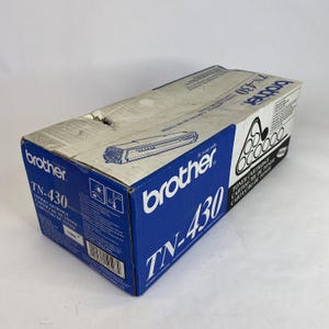 May include: A blue and white Brother TN-430 toner cartridge box. The box features the Brother logo and product information, including "TN-430" in large white text. The box is rectangular and has a slightly worn appearance.