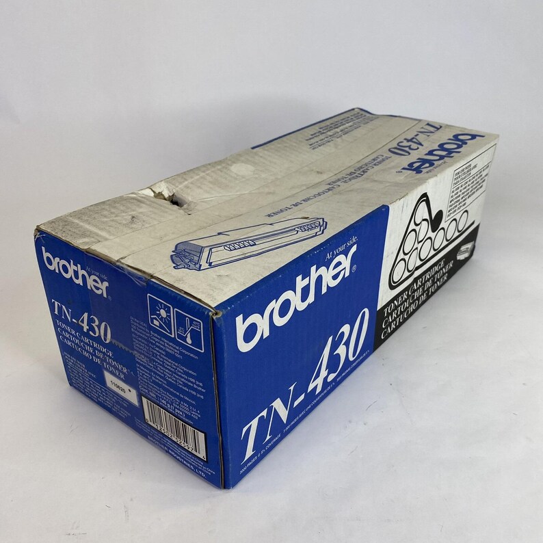 May include: A blue and white Brother TN-430 toner cartridge box. The box features the Brother logo and product information, including "TN-430" in large white text. The box is rectangular and has a slightly worn appearance.