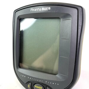 May include: A white ceramic mug with a black handle and the text "But First, Coffee" in a bold, black font. The mug is set against a neutral background, highlighting its simple design.