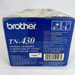 May include: A blue and white Brother TN-430 toner cartridge box. The box features the Brother logo, product information, and a list of compatible printer models. The box also includes a weight of 145 grams.