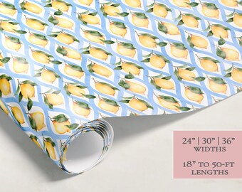May include: A roll of wrapping paper with a lemon pattern on a white background with blue wavy lines. The paper is available in widths of 24 inches, 30 inches, and 36 inches and lengths of 18 inches to 50 feet.
