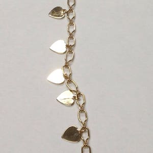Gold toned heart charm necklace, 29"