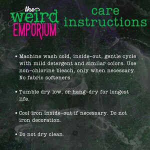 May include: Care instructions for the Weird Emporium. Machine wash cold, inside-out, gentle cycle with mild detergent and similar colors. Use non-chlorine bleach only when necessary. No fabric softeners. Tumble dry low or hang-dry for longest life. Cool iron inside-out if necessary. Do not iron decoration. Do not dry clean.