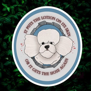 May include: A blue and white round sticker with a white poodle in the center. The text on the sticker reads "It puts the lotion on its skin or it gets the hose again."