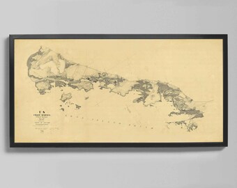 May include: Framed vintage map of a coastal area, featuring detailed land and water features in shades of gray and beige. The map is labeled "US Coast Survey" and is encased in a black frame, suitable for home decor.
