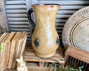 Franse vintage Fleur de Lys-aardewerkkan: handgedraaid geglazuurd aardewerk