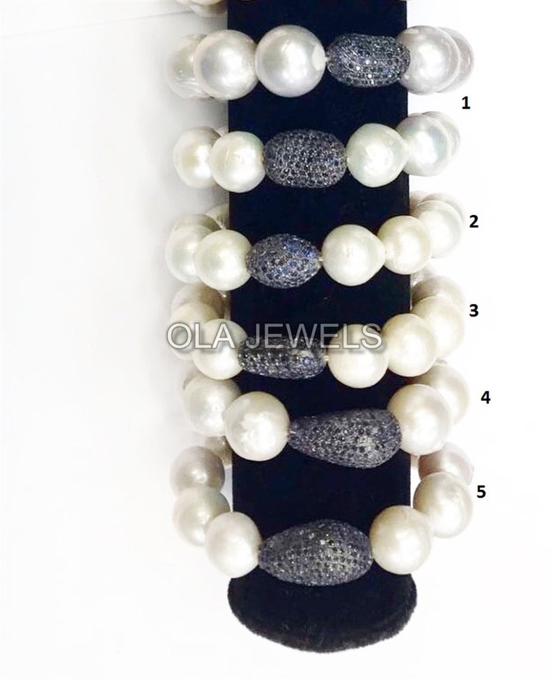 Sterling silver fresh water baroque Pearl stretchy bracelet with blue sapphire bead in center