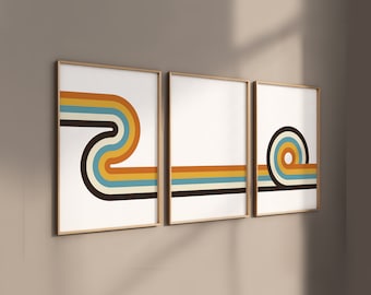 Puede incluir: Tres impresiones enmarcadas con diseños geométricos abstractos en tonos marrones, naranjas, azules y blancos. Los diseños presentan líneas curvas y círculos.