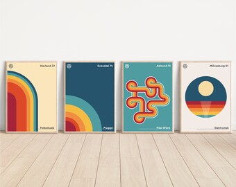 May include: Four framed retro posters with geometric designs and text. The posters feature a colour palette of orange, yellow, blue, and red. Each poster has a unique design, including curved lines and a circular shape. The posters are displayed on a wooden floor.