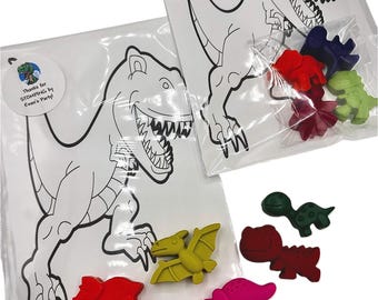 May include: Two clear plastic bags with coloring pages featuring a dinosaur outline. Each bag includes a thank you tag that says "Thanks for STOMPING by Evan's Party!" and a set of dinosaur-shaped crayons in various colors.