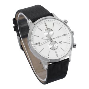 May include: A silver and black chronograph watch with a white face and black leather strap. The watch face has a MANOOCO logo and silver hands.