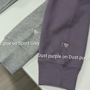 couples matching initial hoodies with a heart