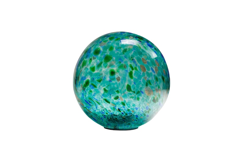 May include: A large, round, blue and green glass globe with a speckled pattern. The globe is made of clear glass with a variety of blue and green flecks throughout.