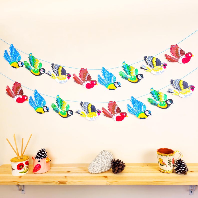 Colourful paper bunting with robins gold finches and blue tits