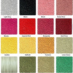 May include: A color chart displaying sixteen square swatches of textured material. Fifteen swatches feature a circular, coiled pattern in light gray, black, blush, dusty rose, beauty, imperial red, burgundy, dark rose, xanthic, daffodil, turmeric, linen green, olive, sage, and bright green. One swatch shows vertical fibers in pistachio.