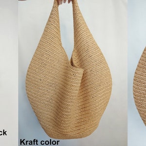 May include: Three hobo-style bags with a textured, woven surface. The bags are shown in three distinct colors: black, labeled as Black; a light tan, labeled as Kraft color; and a medium brown, labeled as Wood. Each bag features a single shoulder strap.