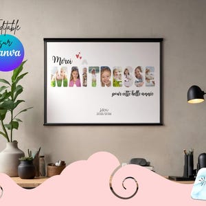 May include: A framed wall art print with the text "Merci Maitresse" and photos of children. The print is in a black frame and is displayed on a desk with a lamp and plants. The text "Editable sur Canva" is also visible.