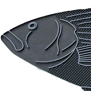 May include: A black rubber doormat shaped like a striped bass fish. The doormat has a textured surface and is designed to scrape dirt and moisture from shoes.