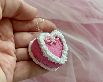 Handgemaakte roze en witte taartoorbellen