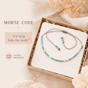 May include: A Morse code bracelet featuring small teal and clear glass beads on a thin gray cord. The bracelet is presented in a square gift box with a card displaying the text MORSE CODE and the phrase I'd help hide the body in a pink box.