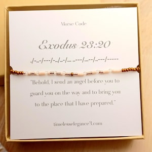 May include: A beaded bracelet with a card inside a box. The card has the text "Morse Code" and "Exodus 23:20" with a Bible verse. The bracelet is made of small, light pink and brown beads. The website timelesselegance3.com is also visible.