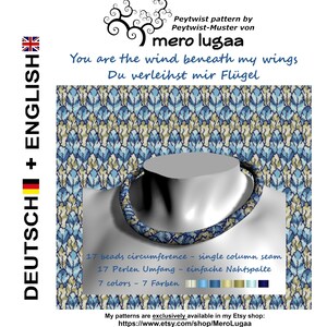 May include: A beaded necklace with a single column seam, made with 17 beads and 7 colors. The necklace is displayed on a mannequin's neck against a background of a blue and beige pattern. The text "You are the wind beneath my wings" and "Du verleihst mir Flügel" is displayed above the necklace.